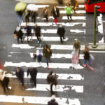 a bunch of pedestrians crossing the street.jpg.crdownload