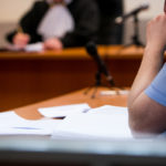 Lawyers listening to the judge in the court room