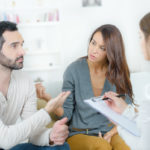 stressed young couple quarrel at the psychologist