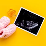 unborn child custody: ultrasound picture and baby shoes